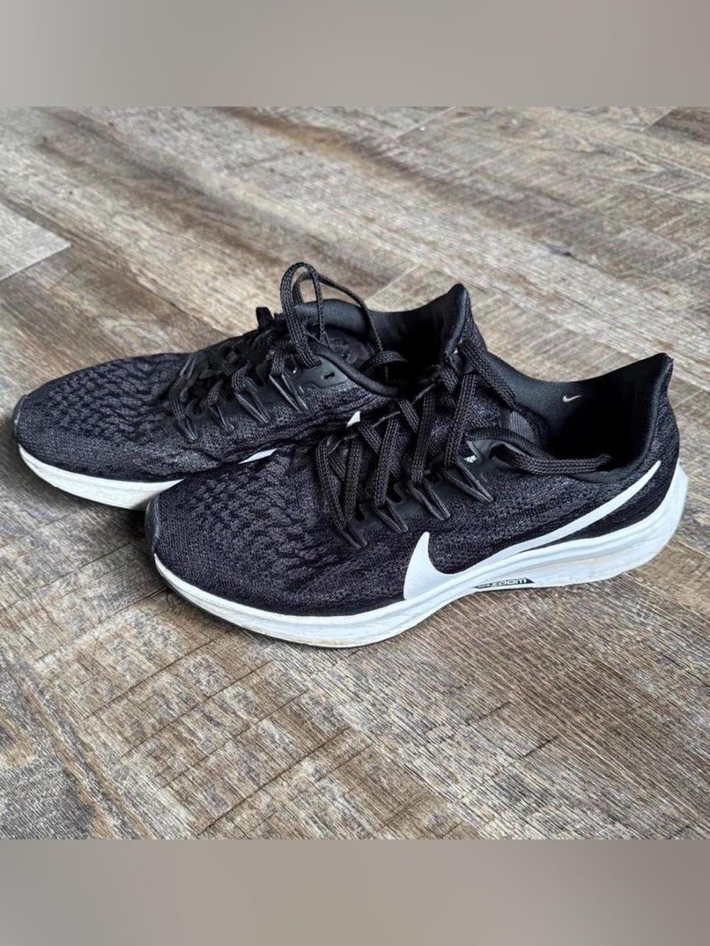 Nike Women’s Black Running Shoes with White Swoosh